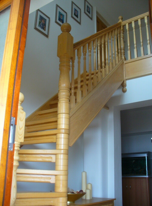 Dog legged open tread staircase - In ash showing 135mm newal post and column