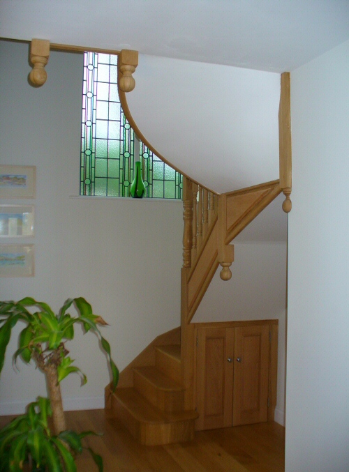 Dog legged staircase - With circular section in oak
