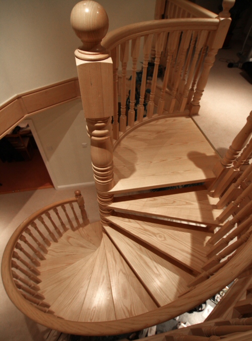 Spiral staircase in ash - Shows 135mm newal post and ball above 135mm central column