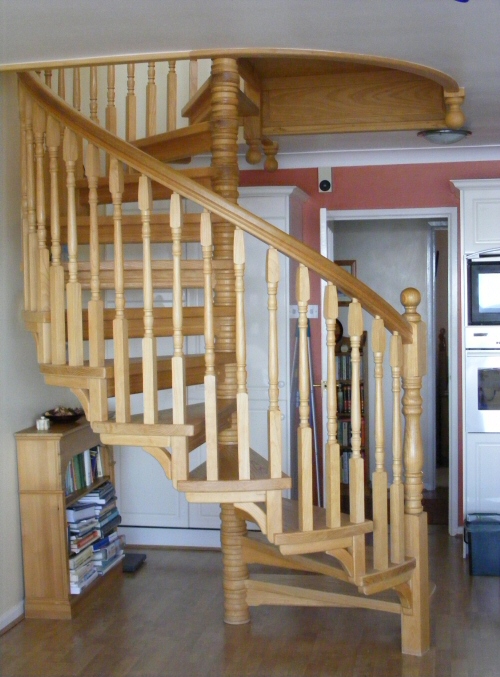 Spiral staircase in ash - with contoured central column and spindles