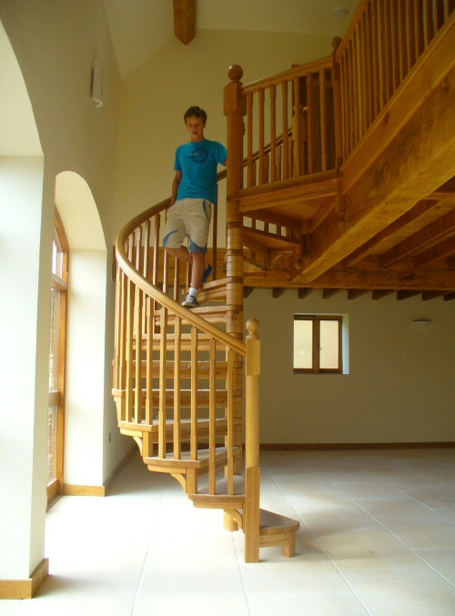 Spiral staircase in stained oak
